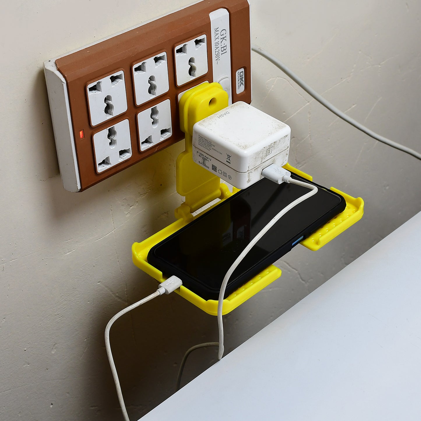 Multi-purpose Wall Holder Stand For Charging Mobile Just Fit In Socket And Hang (Yellow) - Happy Price - Image 4